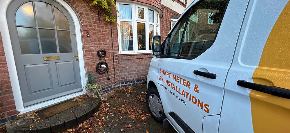 a yu charge ev installation van parked outside of a domestic property