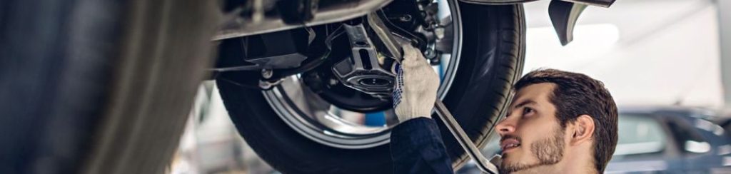 EV car mechanic carrying out maintenance